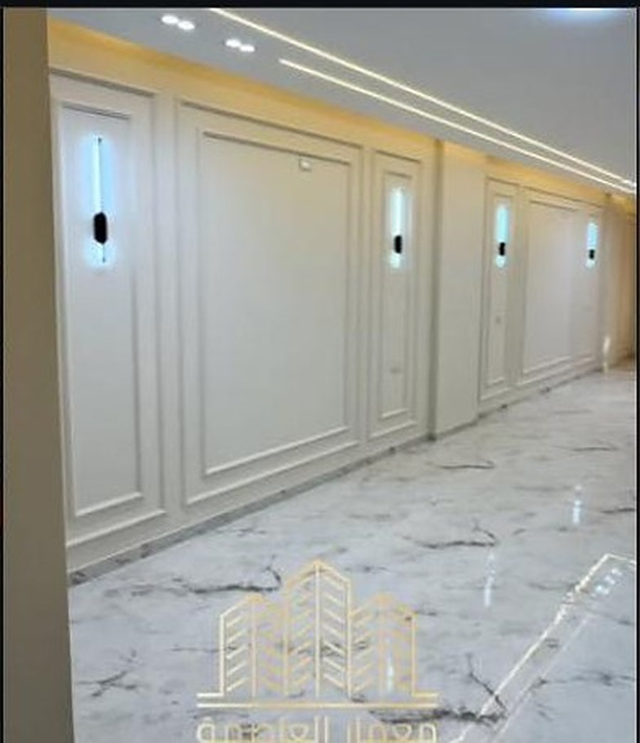 Marble hallway with wall paneling